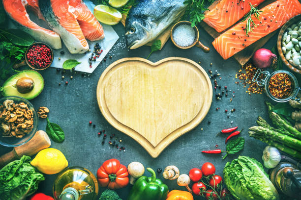 istock Assortment of fresh fish with aromatic herbs, spices and vegetables 680547726
