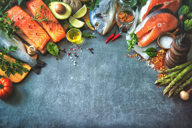 istock Assortment of fresh fish with aromatic herbs, spices and vegetables 680547730