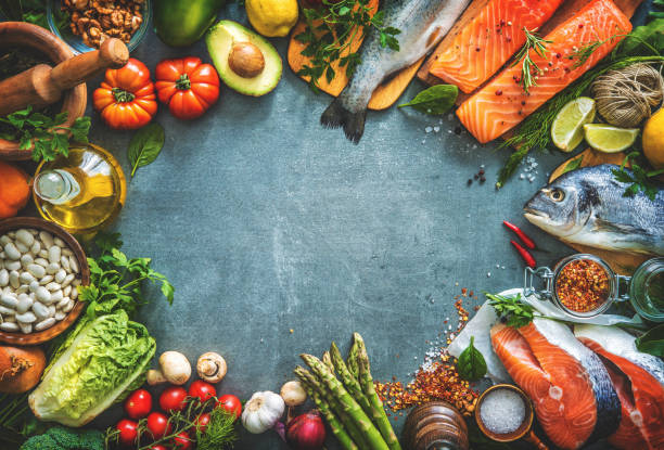 istock Assortment of fresh fish with aromatic herbs, spices and vegetables 680547732