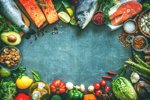 istock Assortment of fresh fish with aromatic herbs, spices and vegetables 680547734
