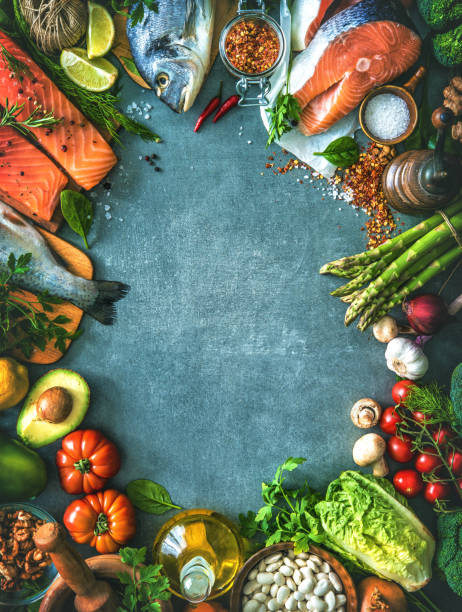 istock Assortment of fresh fish with aromatic herbs, spices and vegetables 680547744