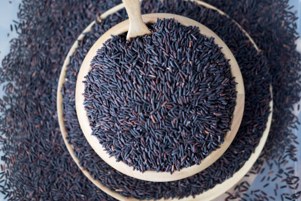 istock Raw berry rice in wooden dish, top view 680548188