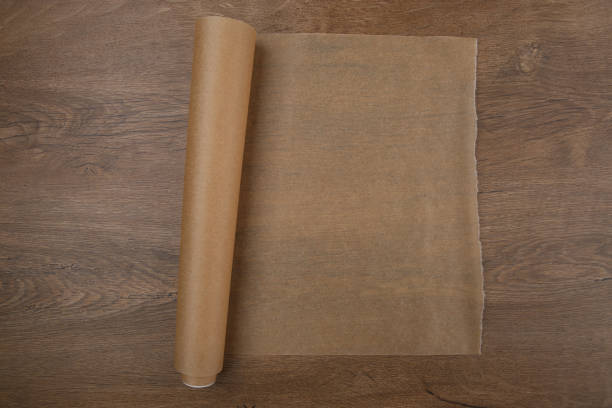 istock Baking paper on wooden background top view. 680636870