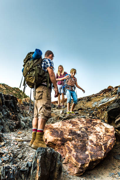 istock Family rock climbing 680639030