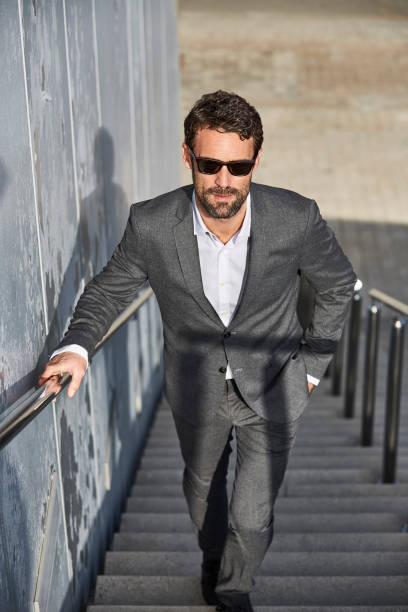 istock Full length of confident executive moving on steps 680641080
