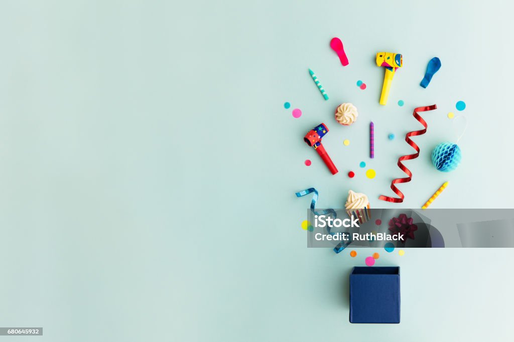 Party objects in a gift box Objects for a birthday party Birthday Stock Photo