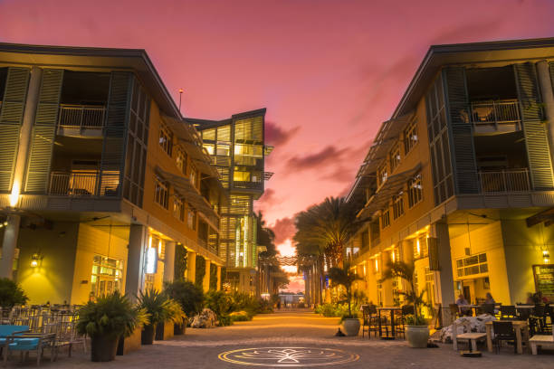 Camana Bay The Paseo Illuminated pedestrian zone at sunset in a waterfront town of Grand Cayman cayman islands stock pictures, royalty-free photos & images