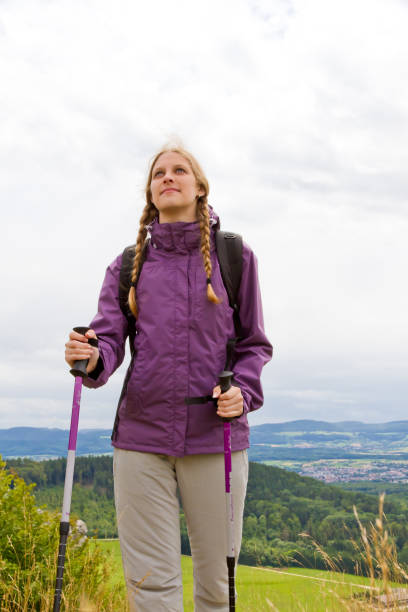istock Young woman hiking in nature 680656926