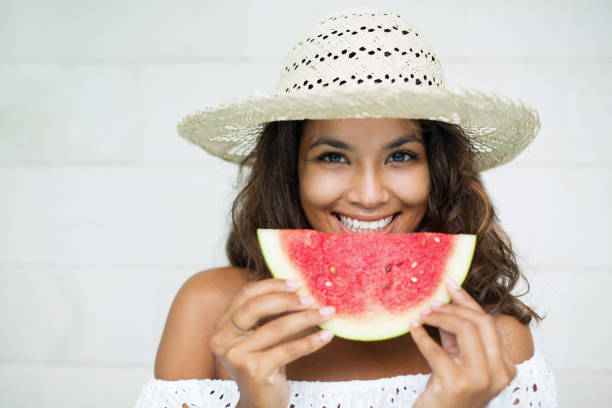 istock Smiling Charming Woman Eating Slice of Watermelon 680657232