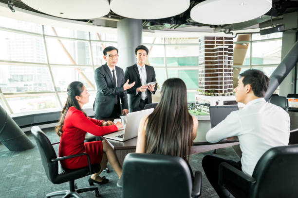 istock White collar worker discuss the details of the project 680657478