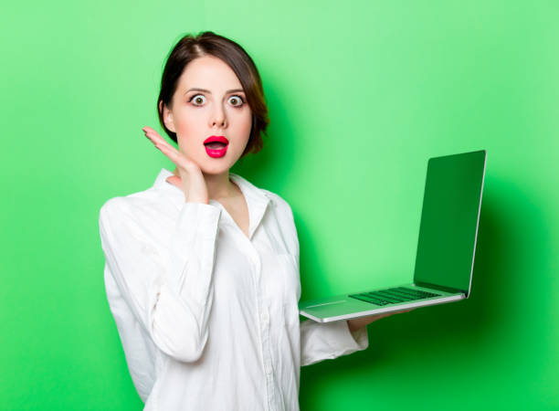 istock young woman with laptop 680665074