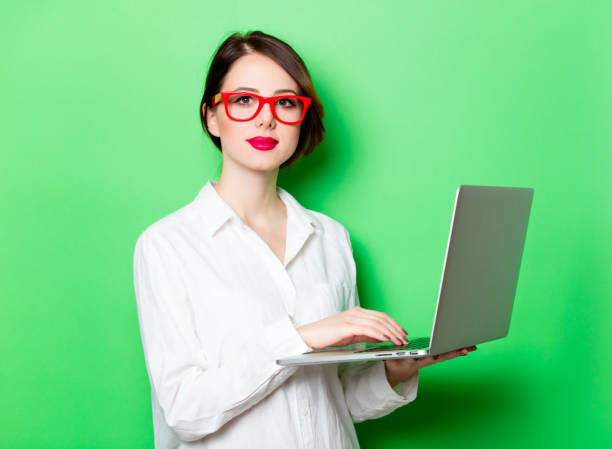 istock young woman with laptop 680665106