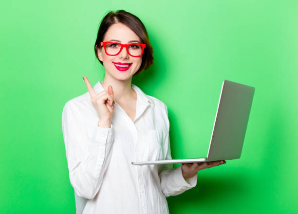 istock young woman with laptop 680665108