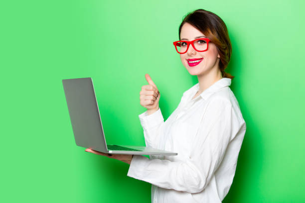 istock young woman with laptop 680665112
