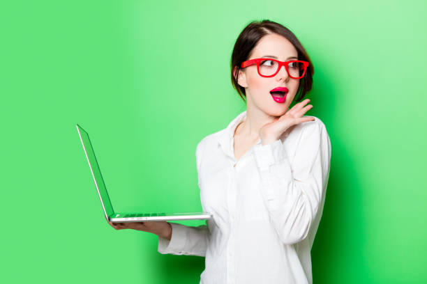 istock young woman with laptop 680665118