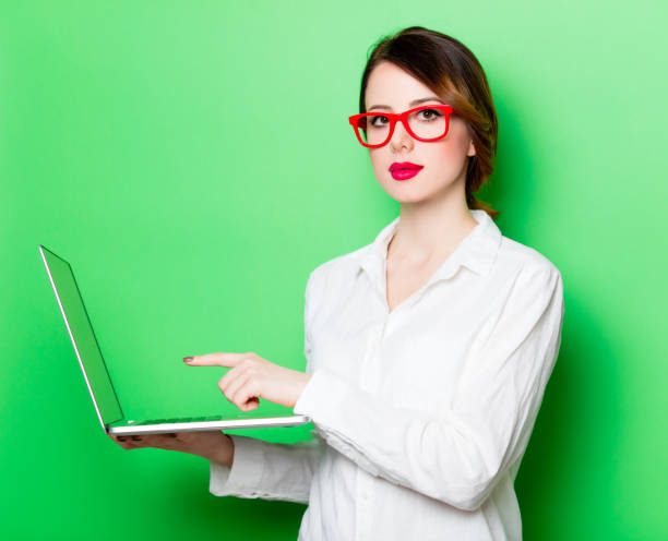 istock young woman with laptop 680665120