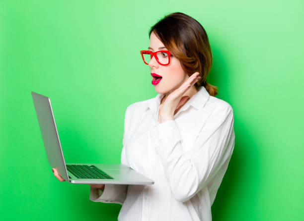 istock young woman with laptop 680665122