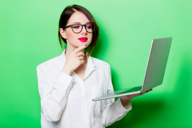istock young woman with laptop 680665282