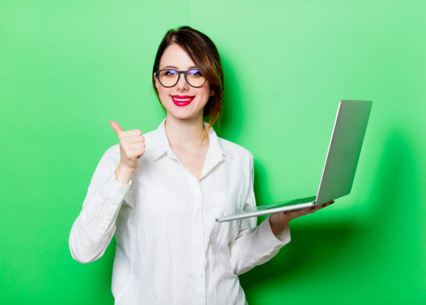 istock young woman with laptop 680665286