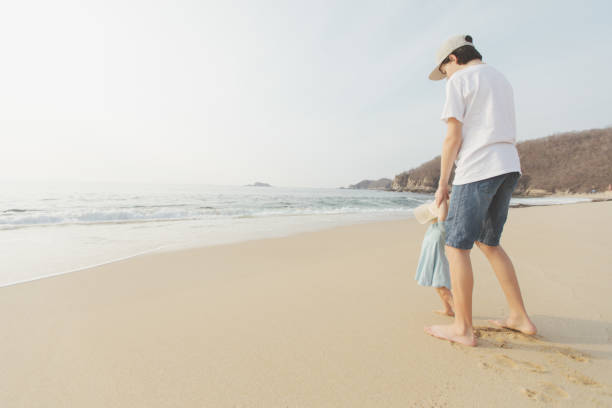 istock Brother And Sister At The Beach 680669514