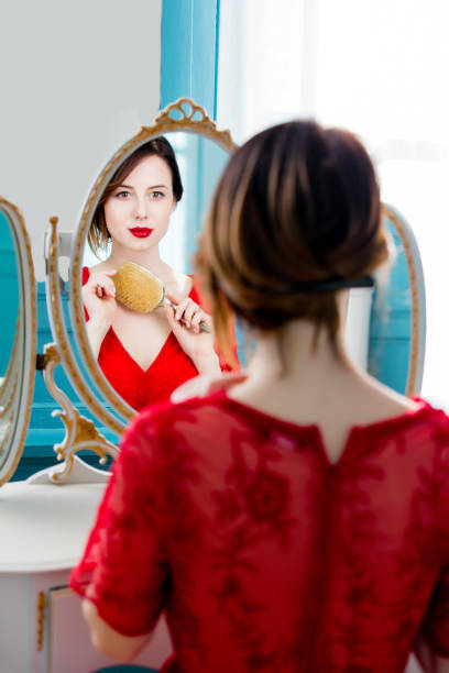 istock young woman with comb 680675756