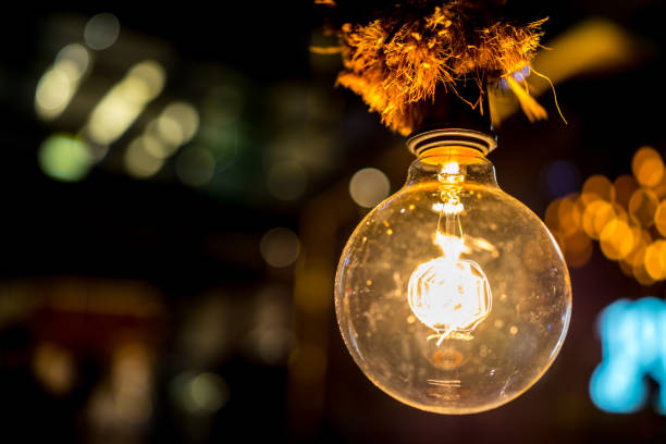 istock innovation and illumination light bulb inspiration with bokehs 680676094