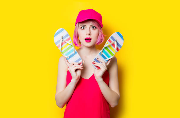 istock young woman with sandals 680676490