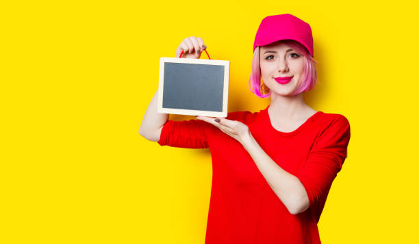 istock young woman with blackboard 680676562