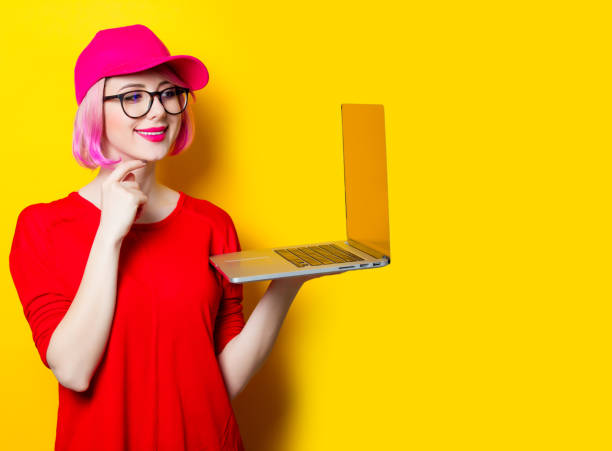 istock young woman with laptop 680676738