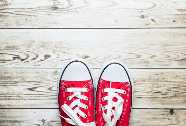 istock red gumshoes on floor 680680646