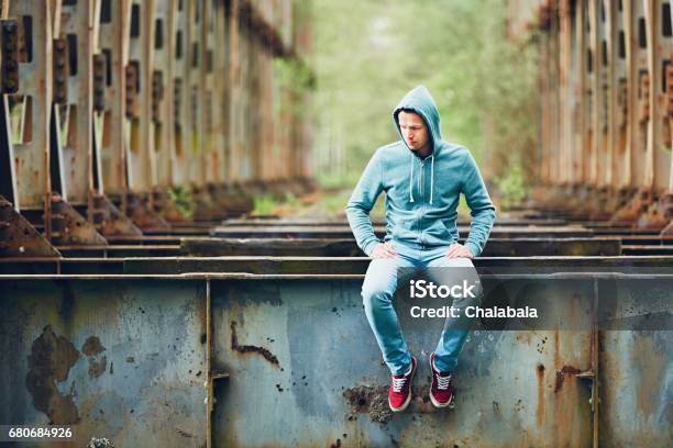 Sad Man On The Abandoned Bridge Stock Photo - Download Image Now - Adult, Adults Only, Adventure