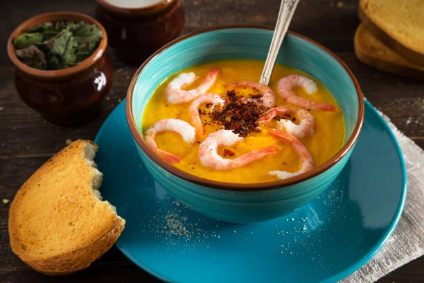 istock Pumpkin cream soup with shrimps 680687448