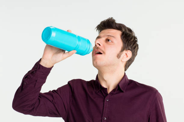 istock Young Businessman Holding Coffee Cups 680687548