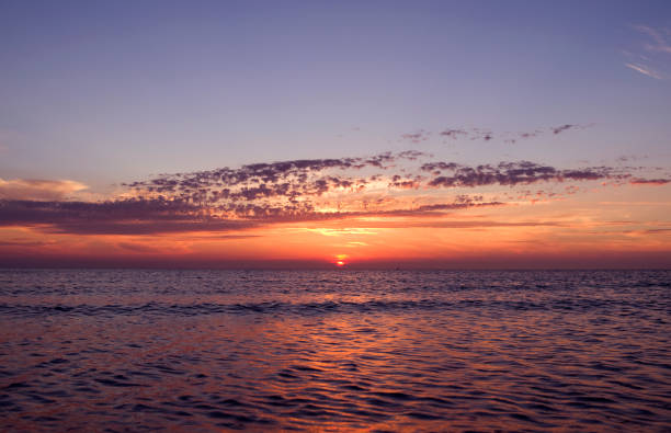istock Denmark: Dreamlike sunset with orange-red glowing sky over the Baltic Sea 680687746