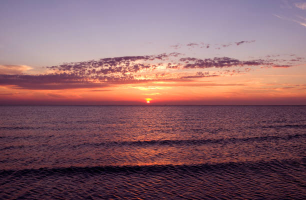 istock Denmark: Dreamlike sunset with orange-red glowing sky over the Baltic Sea 680688144
