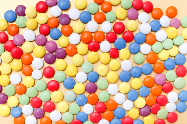 istock lollipops, candy, top view flat lay on yellow background 680691368