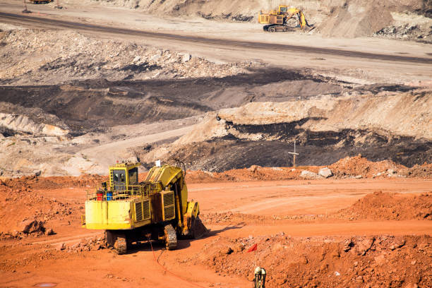 istock Part of a coal mine pit with big mining Excavator 680694716