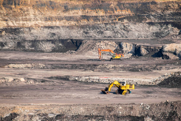 istock Part of a coal mine pit with big mining Excavator 680694738