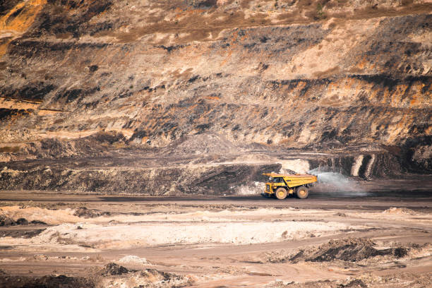 istock Part of a coal mine pit with big mining truck working 680695008