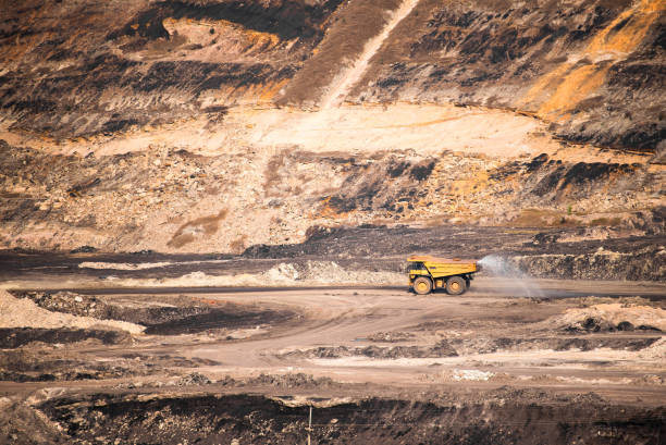 istock Part of a coal mine pit with big mining truck working 680695090