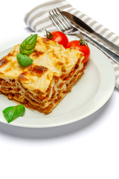 istock Portion of tasty lasagna isolated on white 680702492