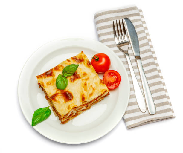 istock Portion of tasty lasagna isolated on white 680702512