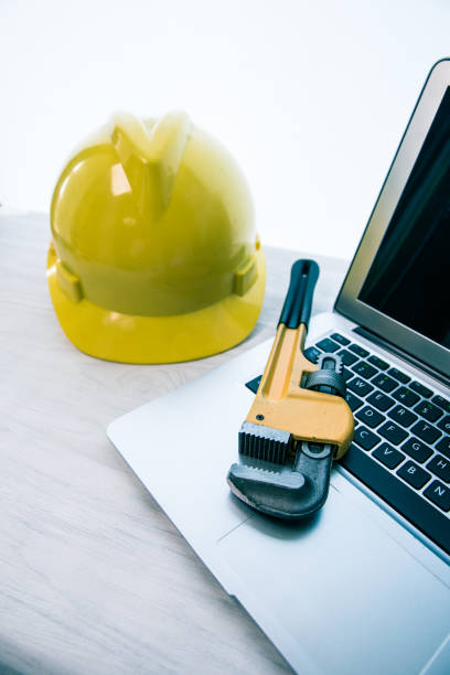 istock Wrench Pipe with safety helmet 680706992