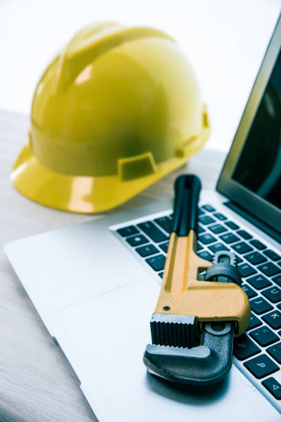istock Wrench Pipe with safety helmet 680707260