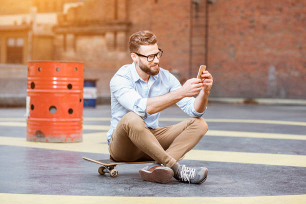 istock Businessman with smart phone on the rooftop 680710184