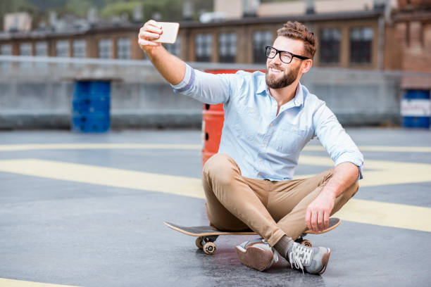 istock Businessman with smart phone on the rooftop 680710254