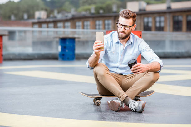 istock Businessman with smart phone on the rooftop 680710296