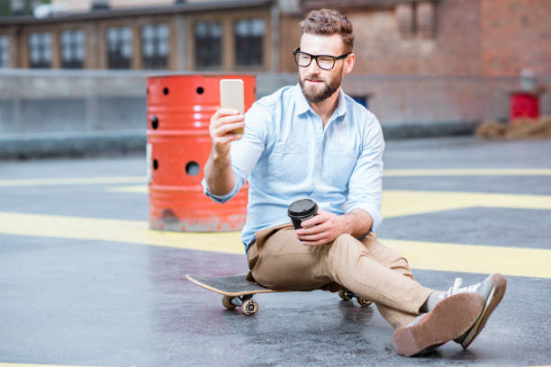 istock Businessman with smart phone on the rooftop 680710352
