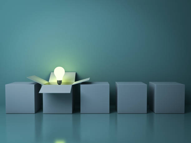 Stand out from the crowd different creative idea concepts , One white opened box with idea light bulb glowing among close square boxes on green background in the row with reflections . 3D render stock photo