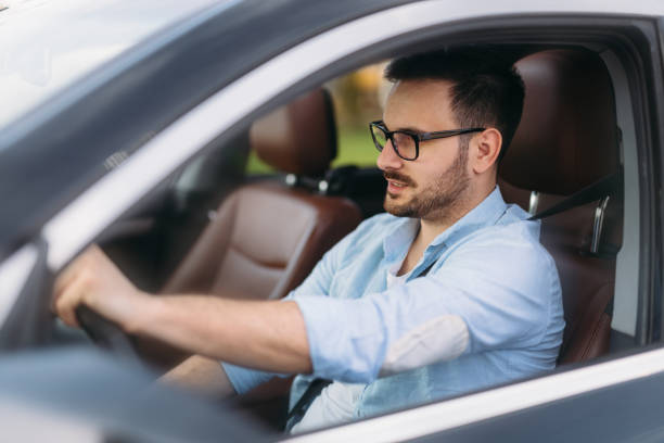 istock Handsome businessman driving a car to work 680714578